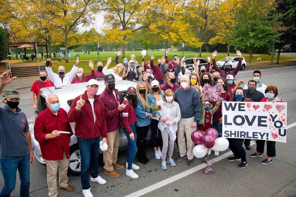 People participate in a surprise parade on Saturday afternoon to celebrate the life of legendary Mercer Island High School boys basketball coach Ed Pepple, who passed away on Sept. 14 at the age of 88. The event also honored his widow, Shirley, who will move to San Diego  to be with her kids, grandchildren and great-grandchildren  after living on the Island for 53 years. The parade began on the corner of Southeast 32nd Street and 77th Avenue Southeast. Photo courtesy of Bob Swanson