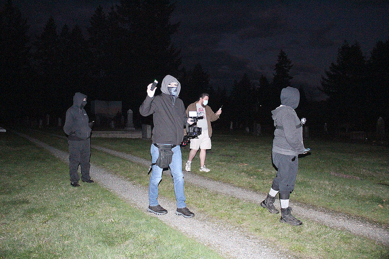 The first part of Cascadia Paranormal Investigations exploration of the Black Diamond Cemetery involved trying to find all the non-paranormal explanations for the phenomenon some people have reported at the site before sitting down with their arsenal of electronics to find any evidence of ghosts or spirits. Photos by Ray Miller-Still