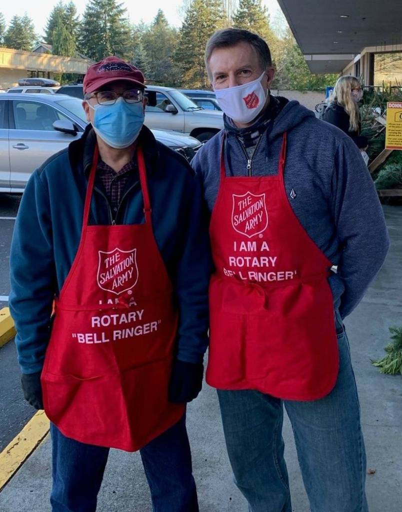 Mercer Island Mayor Benson Wong, left, and Police Chief Ed Holmes rang the bell for the Salvation Army donation drive Dec. 5 at the south end QFC. Courtesy photo