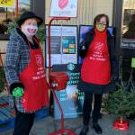 Rotary Club of Mercer Island President Judy Clibborn, left, and Petra Walker (Rotarian organizer for the bell ringing this year), right, stand outside the north end QFC on a recent weekend to raise funds for those in need through The Salvation Army. There has never been a time when we have felt more motivated, though challenged, to be out there at our two local QFCs and Walgreens, reads a Rotary press release. Rotarians are gratified to help and they are always moved when people are smiling as they place their contributions in the bucket. Courtesy photo