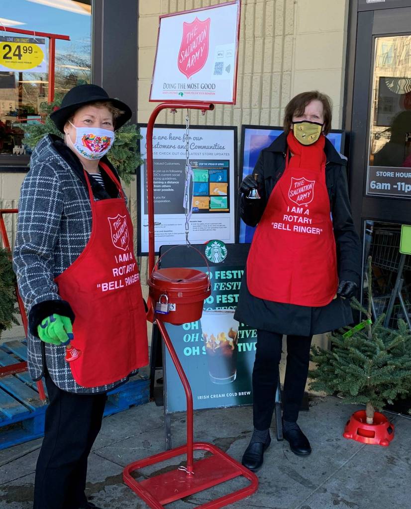 Rotary Club of Mercer Island President Judy Clibborn, left, and Petra Walker (Rotarian organizer for the bell ringing this year), right, stand outside the north end QFC on a recent weekend to raise funds for those in need through The Salvation Army. There has never been a time when we have felt more motivated, though challenged, to be out there at our two local QFCs and Walgreens, reads a Rotary press release. Rotarians are gratified to help and they are always moved when people are smiling as they place their contributions in the bucket. Courtesy photo