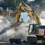 A demolition worker hammers away at the old East Seattle School with a machine on Dec. 28. The city issued a demolition permit for the school  which was built in 1914  on Oct. 28. It is located at 2825 West Mercer Way. The citys decision was informed by the Environmental Impact Statement (EIS), which was completed by EA Engineering, Science and Technology and examined the potential impacts of different alternative actions. An architectural assessment report in the final EIS, notes that, for the most part the buildings have reached the end of their architectural lifespan without extensive, and costly rehabilitation. According to the city website, the property will be subdivided into 14 residential lots. More on the story to come this week. Andy Nystrom/ Reporter