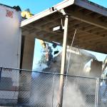 Demolition takes place at the old East Seattle School on West Mercer Way on Dec. 28. The city issued a demolition permit for the school  which was built in 1914  on Oct. 28. Andy Nystrom/ Reporter