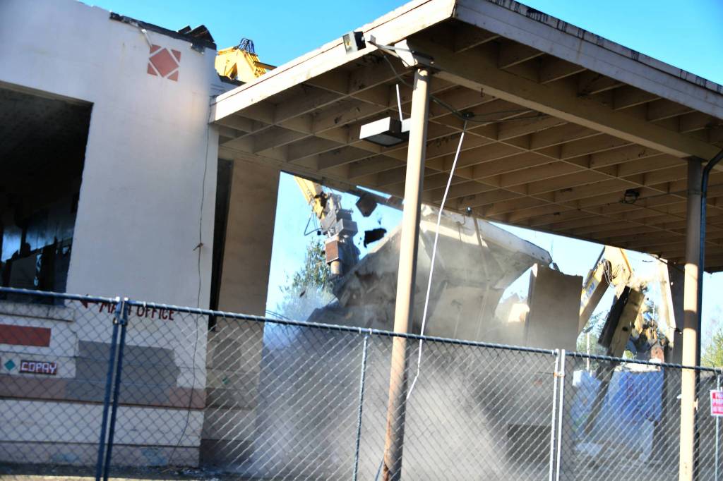 Demolition takes place at the old East Seattle School on West Mercer Way on Dec. 28. The city issued a demolition permit for the school  which was built in 1914  on Oct. 28. Andy Nystrom/ Reporter