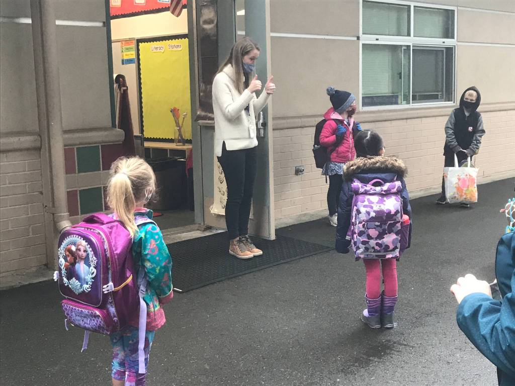 A kindergarten teacher greets students outside at Lakeridge Elementary School on Jan. 6. Photo courtesy of the Mercer Island School District