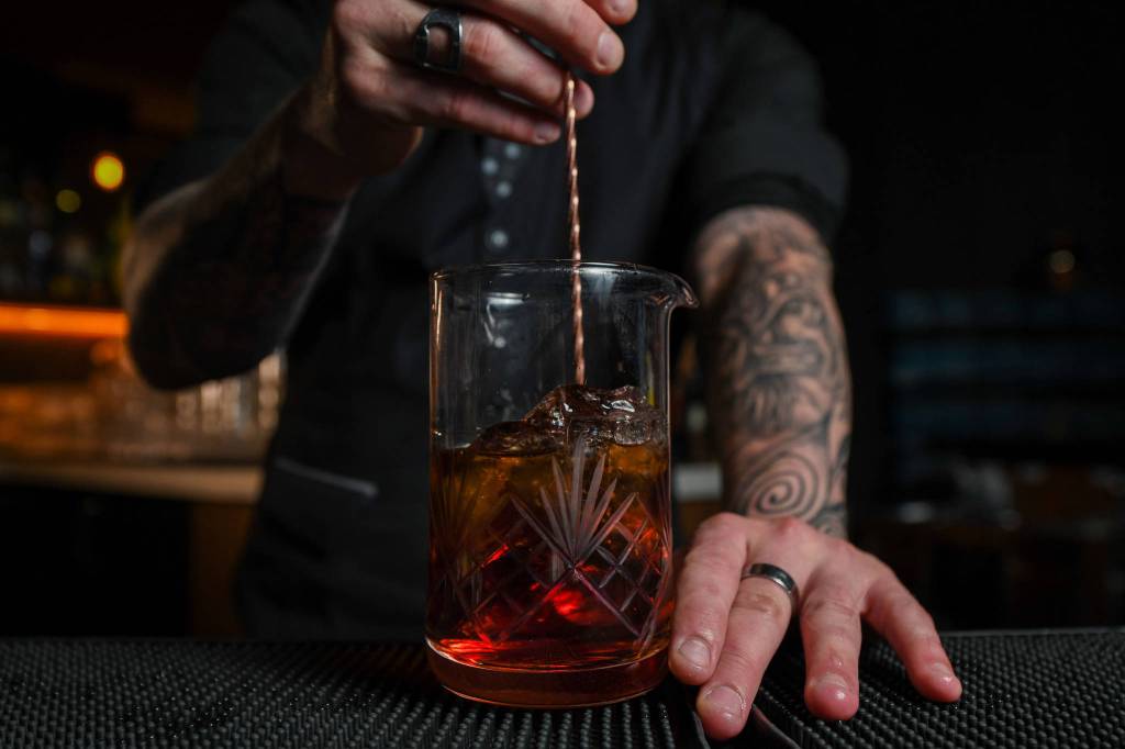 Joe Dietrich, bar manager at Civility & Unrest, stirs a cocktail. Courtesy photo