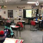 An Island Park Elementary teacher and her students hit the books on Feb. 8. Courtesy of the Mercer Island School District