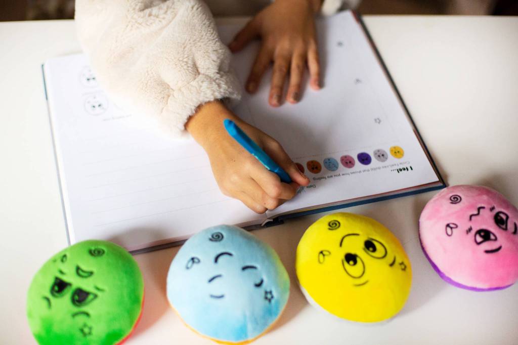 FeelLinks features feeling dolls and a feeling journal. Photo courtesy of Genevieve Kathleen Photography