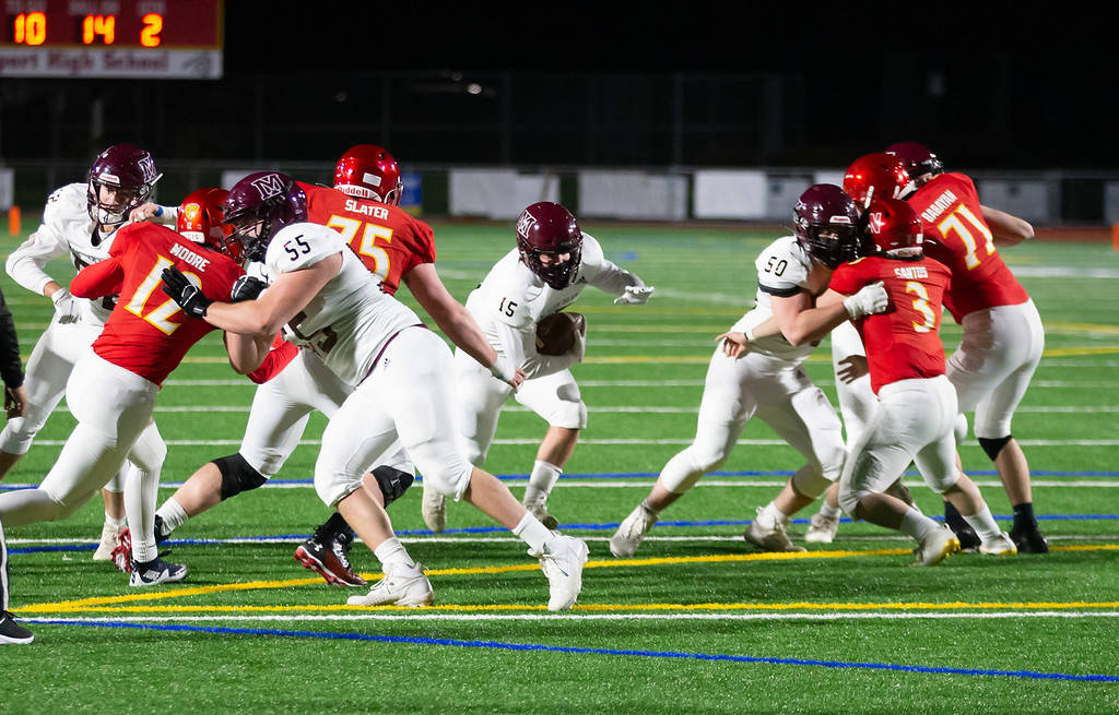 Mercer Islands Jack Rowe runs through the Newport line. Photo courtesy of David Wisenteiner