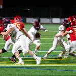 Mercer Islands Jack Rowe runs through the Newport line. Photo courtesy of David Wisenteiner
