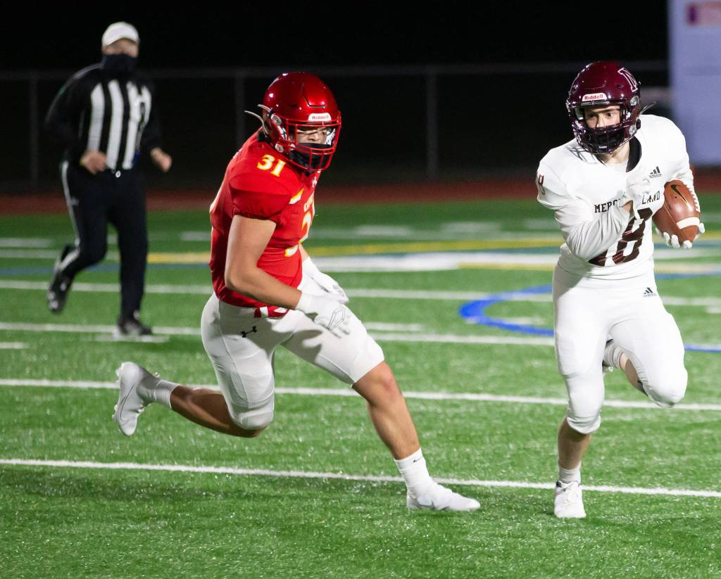 Mercer Islands Luke Shavey runs the ball up field against Newport. Photo courtesy of David Wisenteiner