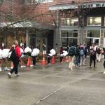 Cheerleaders line the walkway as students in the A cohort at Mercer Island High School returned to classes on March 22 for two days of hybrid learning, with the B cohort coming to school on March 25. Photo courtesy of the Mercer Island School District