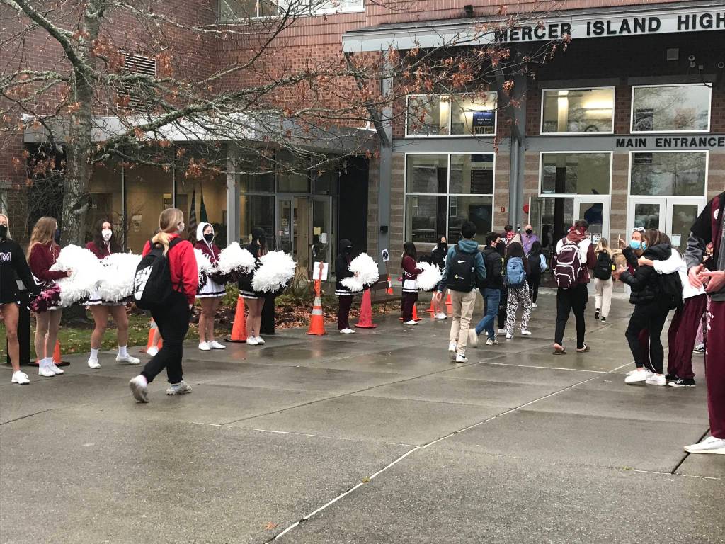 Cheerleaders line the walkway as students in the A cohort at Mercer Island High School returned to classes on March 22 for two days of hybrid learning, with the B cohort coming to school on March 25. Photo courtesy of the Mercer Island School District