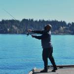 Anthony Berry gets in some fishing off a dock at Luther Burbank Park on a sunny Saturday. Temperatures reached 80 degrees in the region. Andy Nystrom/ staff photo