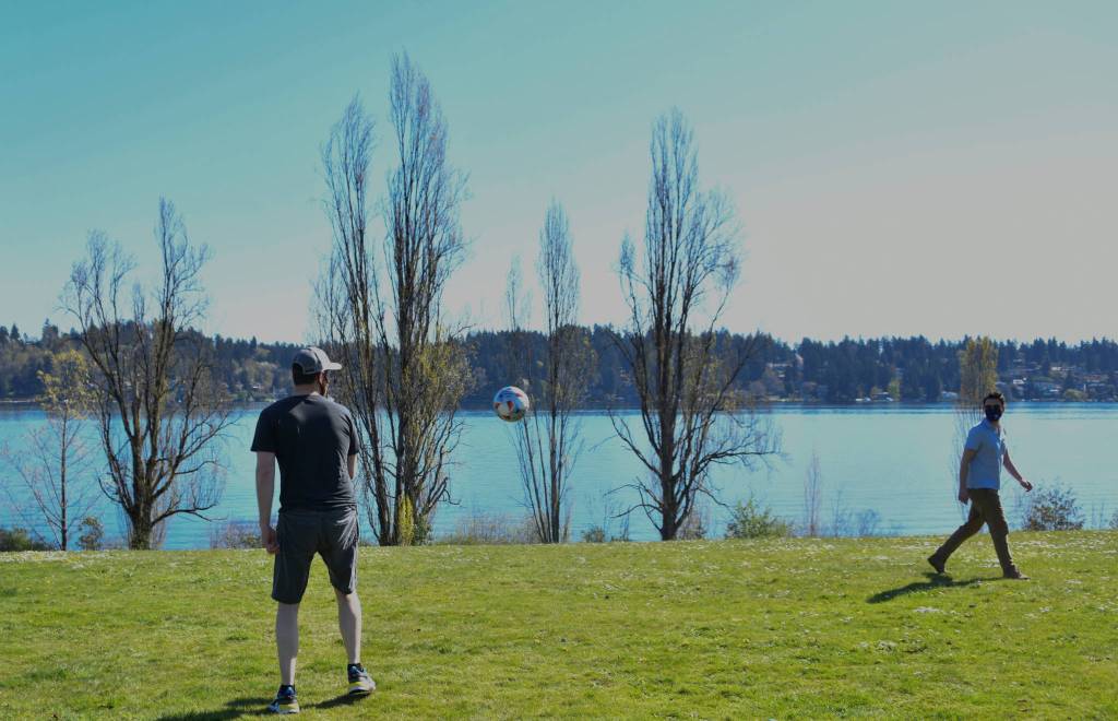 Matthew Hallowell, left, and Justin Little play soccer at Luther Burbank Park on Saturday. Andy Nystrom/ staff photo