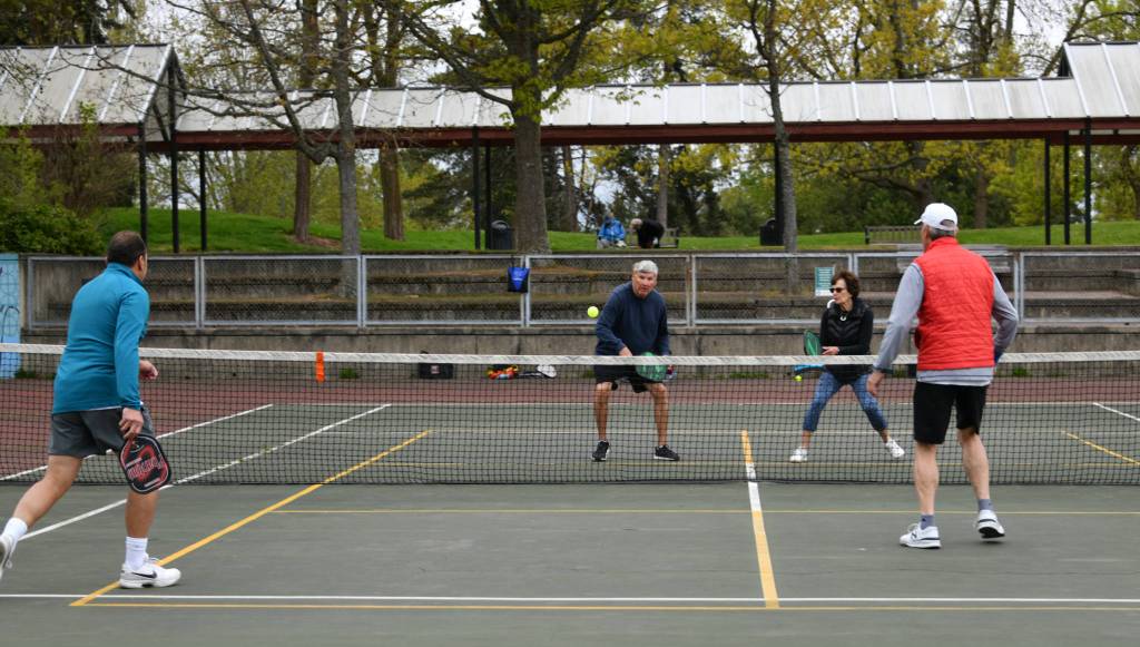 In April 27 morning pickleball action at Luther Burbank Park, Tom Krazit makes a shot next to partner Carolyn Starr. Van Rex Gallard is at the back left with partner Tom Robinson. Andy Nystrom/ staff photo