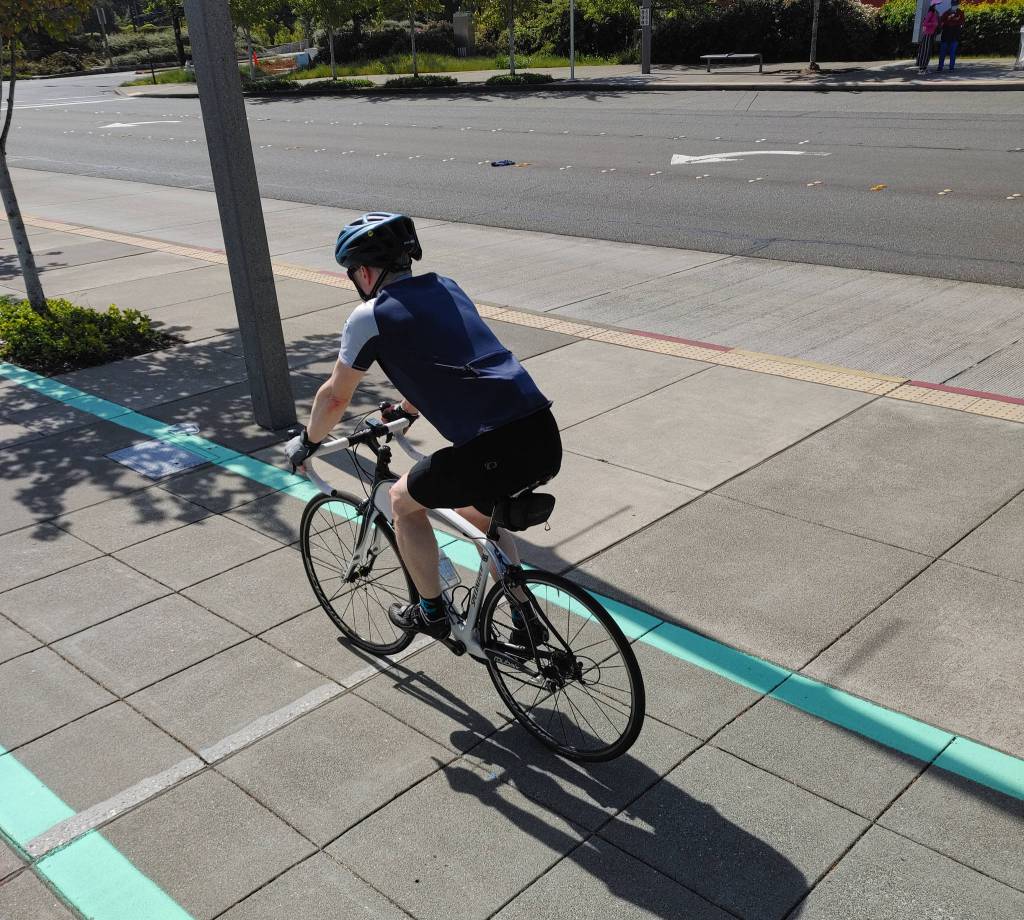 A cyclist cruises through Mercer Island on May 15. Andy Nystrom/ staff photo