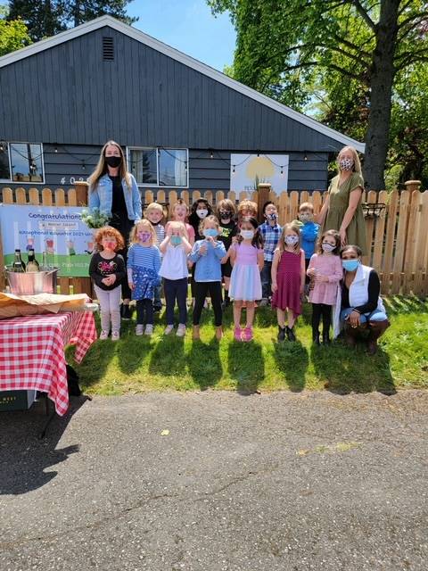 Beth Christofferson (top left) enjoys her surprise celebration after receiving the Mercer Island Preschool Association Exceptional Educator award on May 21. Photo courtesy of Rachel Bermudez