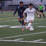 Mercer Island senior captain Josh Chang, front, controls the ball against Interlake. Photo courtesy of Lis Larkin