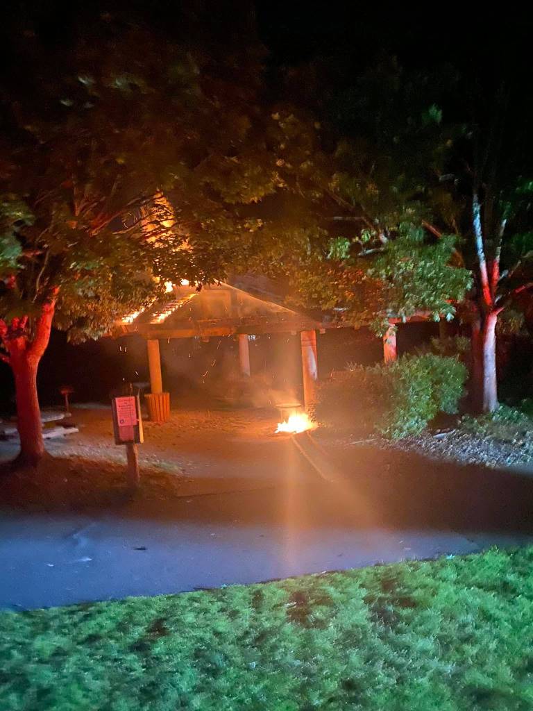 Mercer Island Fire Department (MIFD) crews extinguished a small trash can fire that extended to the covered area roof of the picnic shelter at Aubrey Davis Park (Lid Park) on the night of June 1, according to the MIFD. The exposed wood framing members of the structure were severely damaged, and flames could be witnessed from Interstate 90. Upon closer examination, it appears that the fire may have been deliberately set as at least one other trash can in the area also had been burned, reads a MIFD press release. The Mercer Island Fire Marshals Office and Mercer Island Police Department are investigating the fire. Photo courtesy of the Mercer Island Fire Department