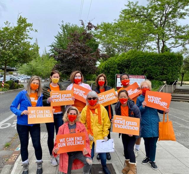 A group of Mercer Island PTA and community members joined some Moms Demand Action members from the greater Seattle area at the Farmers Market on Sunday to distribute orange ribbon pins to honor victims and survivors of gun violence. Photo courtesy of Lori Cohen-Sanford