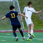 Mercer Islands Brady Gilroy battles Bellevues Jake Chung for the ball in a June 3 match. Mercer Island won, 3-0, on goals from Gilroy, Alec Willet and Tripp White. Photo courtesy of Stephanie Ault Justus