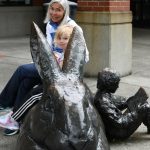 Linda Lisbakken sits with her granddaughter, Berrit Martz, 4, prior to the reopening of the Mercer Island Library on July 7. They were excitedly waiting for the doors to open while partaking in their lunch on the librarys signature rabbit statue. The library  located at 4400 88th Ave. SE  had been closed since March of 2020 when the COVID-19 pandemic hit. Doors will be open from 1-8 p.m. Tuesdays and Wednesdays and from 10 a.m. to 5 p.m. Thursdays, Fridays and Saturdays. Andy Nystrom/ staff photo