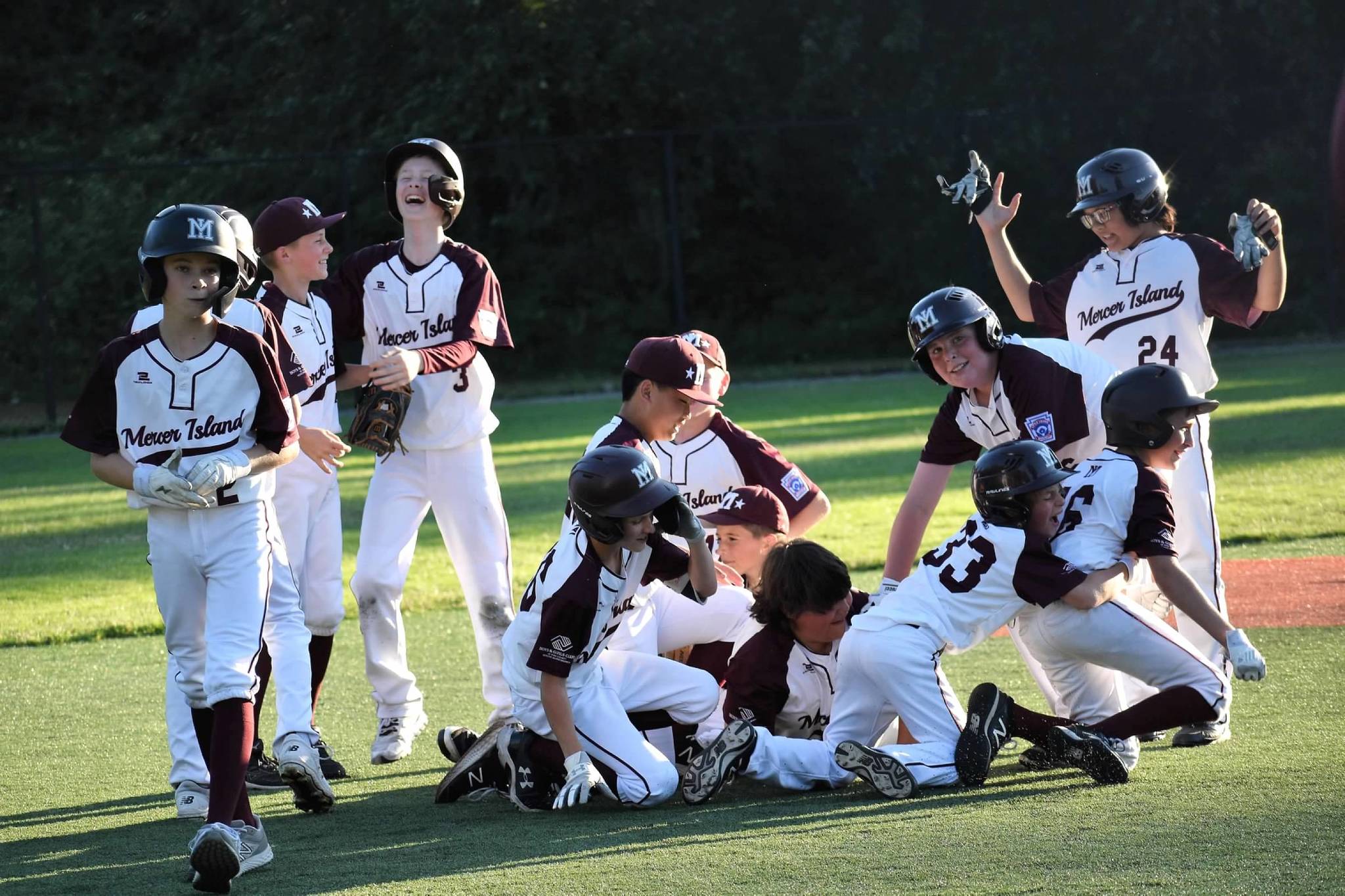The Mercer Island Little League majors all-star team lost to Eastlake, 11-10, in game two of the District 9 final on July 12. The second-place local squad won its first three games of the double-elimination tournament over Bellevue Thunderbird (18-3), Sammamish (18-1) and Eastlake (4-3) at South Mercer Playfields. Mercer Island faced Eastlake twice more  after Eastlake advanced through the losers bracket  for the championship, with the locals losing both games. Eastlake won game one in extra innings, 8-6, to set up the final game. Pictured are Mercer Island players dog-piling to celebrate their victory over Eastlake on July 9. Eastlake won the state championship on July 26 over Lake Stevens, 6-0. The team is: Ben Shleifer, Brady Dolence, Brady Mock, Cash Little, Chase Kelly, Dash Dahlberg, Ethan Nguyen, Ewan Shea, Joey Weiss, Liam Sirianni, Lucas Kornylo, Mattias Hofstetter, Theo Roodman and coaches Eric Dahlberg, Jay Shleifer and Casey Little. Photo courtesy of Kym Otte