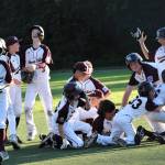 The Mercer Island Little League majors all-star team lost to Eastlake, 11-10, in game two of the District 9 final on July 12. The second-place local squad won its first three games of the double-elimination tournament over Bellevue Thunderbird (18-3), Sammamish (18-1) and Eastlake (4-3) at South Mercer Playfields. Mercer Island faced Eastlake twice more  after Eastlake advanced through the losers bracket  for the championship, with the locals losing both games. Eastlake won game one in extra innings, 8-6, to set up the final game. Pictured are Mercer Island players dog-piling to celebrate their victory over Eastlake on July 9. Eastlake won the state championship on July 26 over Lake Stevens, 6-0. The team is: Ben Shleifer, Brady Dolence, Brady Mock, Cash Little, Chase Kelly, Dash Dahlberg, Ethan Nguyen, Ewan Shea, Joey Weiss, Liam Sirianni, Lucas Kornylo, Mattias Hofstetter, Theo Roodman and coaches Eric Dahlberg, Jay Shleifer and Casey Little. Photo courtesy of Kym Otte