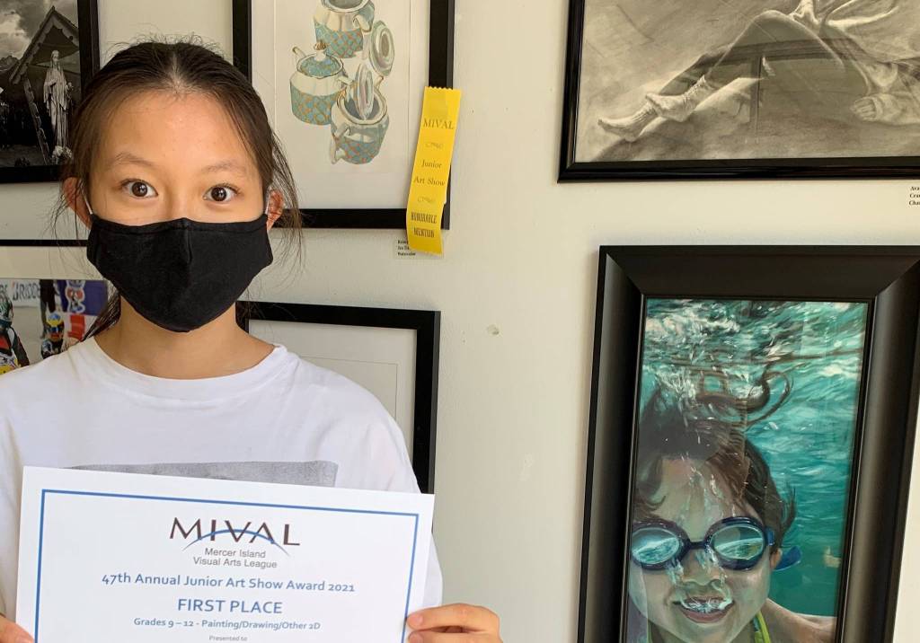 Ninth-grader Ava Yeh stands with her first-place acrylic painting, An Astronomical Swim, in the category for 2D art for grades 9-12 at the Mercer Island Visual Arts League (MIVAL) Junior Arts Show. The 47-year tradition continues at the MIVAL Gallery, 2836 78th Ave. SE, through Aug. 27. The gallery is open from noon to 6 p.m. Thursday-Saturday and noon to 4 p.m. Sunday. The show, which is sponsored by MIVAL, Wells Fargo Bank and Coldwell Banker Bain, hosts artwork by children in grades K-12 and includes drawing, painting, photography, ceramics, other 3D art and digitally produced images. Photo courtesy of the Mercer Island Visual Arts League