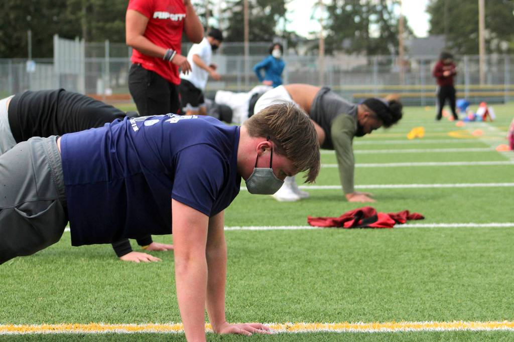 A Decatur High School student in Federal Way participates in a conditioning workout in Feb. 2021 as the state eased back in to in-person activities. Olivia Sullivan/Sound Publishing