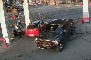 This 2019 security footage at the Cenex gas station in Black Diamond shows Anthony Chilcott on his phone before entering, and driving off with, Carl Sanders Ford Raptor and Monkey, his poodle, in the front seat. Courtesy photo