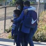 A mother hugs her children before they head toward the Northwood school building. Andy Nystrom/ staff photo