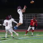 Mercer Island High Schools Garrett Rogan leaps for the ball in a game last season. Photo courtesy of David Wisenteiner