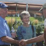 Covenant resident Pete Baird, right, talks with David and Peggy Beamer following the program. Andy Nystrom/ staff photo