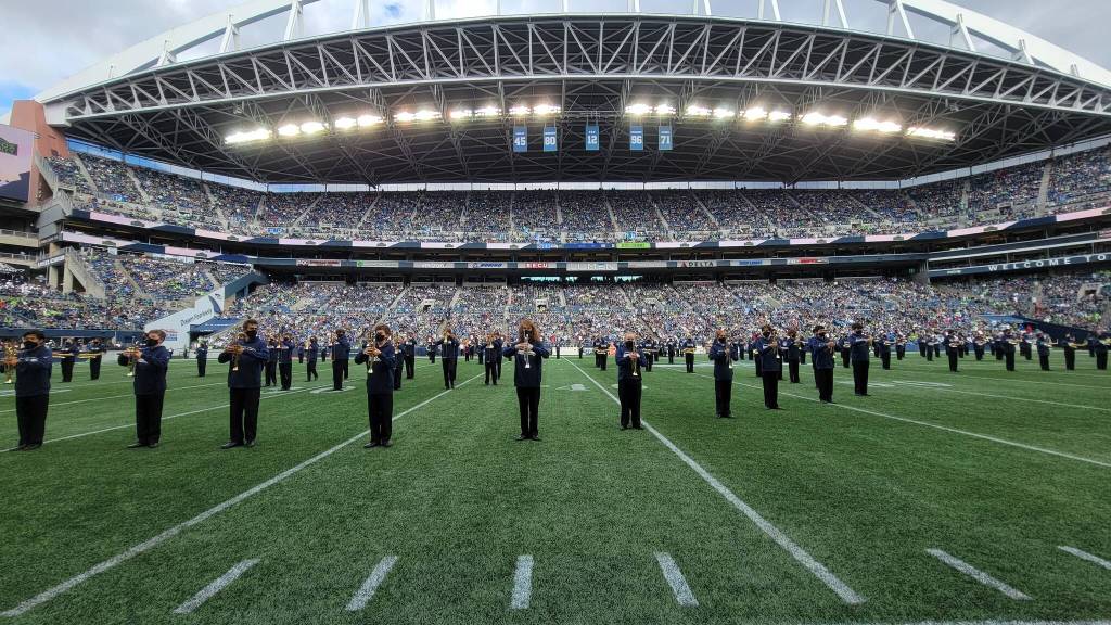 The Mercer Island High School marching band performed twice on Sept. 19 at the Seattle Seahawks regular season home opener versus the Tennessee Titans at Lumen Field. The Islanders first took the field for a special pregame concert featuring Seattles Macklemore and singer-guitarist Ayron Jones and provided visual support sans instruments. At halftime, the band played the CBS Sports/NFL theme. Tennessee beat the Seahawks, 33-30, in overtime. Photo courtesy of Joe Chen