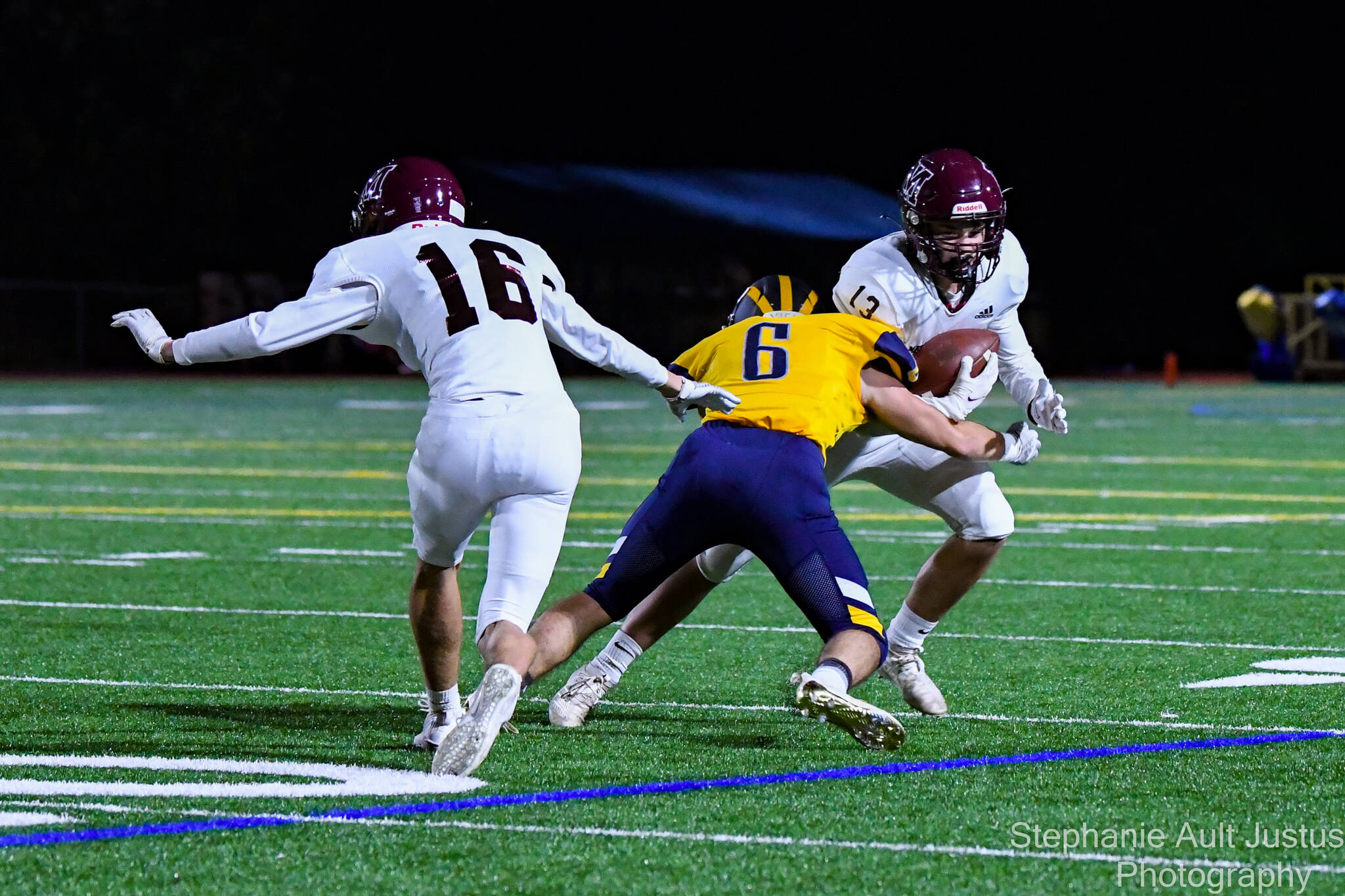Bellevues Matt Yamamoto tackles Mercer Islands Addison King while Mercer Islands Davis Johnson enters the action during Bellevues 49-0 football victory on Oct. 1. MI quarterback Eli Fahey went 17-for-34 for 165 yards, including eight passes to Cole Drayton for 76 yards. Chase Shavey amassed eight solo tackles and seven assists for the Islanders (1-1 in 3A KingCo and 3-2 overall), who will next play at Liberty (Renton) at 7 p.m. on Oct. 8. Photo courtesy of Stephanie Ault Justus