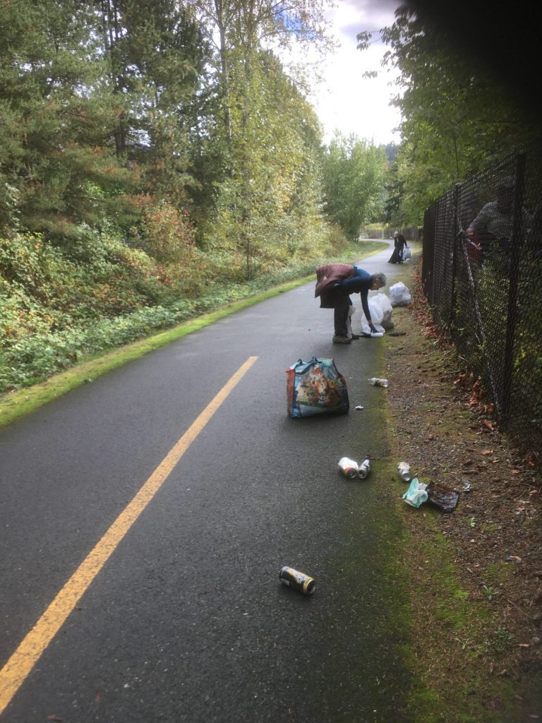 Rotary Club of Mercer Island members equipped with gloves, boots, bags and determination worked together to clean up a section of the Issaquah-Preston Trail on Oct. 16. The afternoons effort was all part of the clubs Planet Earth Committee that focuses on minimizing the negative impacts of humanity on our earth and sending positive messages about respecting our environment. Truly dirty work for a good cause, reads a Rotary project report. Courtesy photo