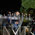 Chabad Mercer Island Director and Rabbi Nissan Kornfeld eyes the ice menorah on Dec. 2 at Mercerdale Park. Photo courtesy of James N.
