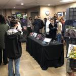 Island House recently hosted an art show featuring photos from Mercer Island High School students. At the event, Mac McQuade also collected donations for the Downsizing Network.