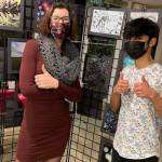 Mercer Island High School photography/advanced placement 2-D teacher Laura Anders and student Mustafa Agha at the schools art show on Dec. 9 at Island House. Courtesy photo