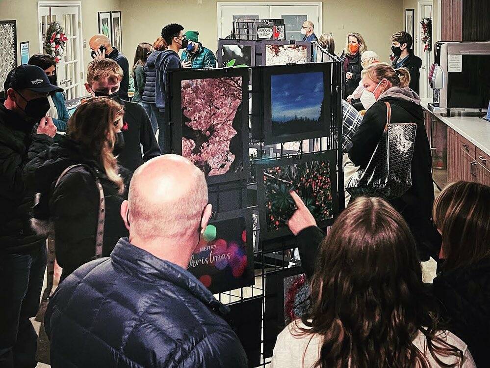Attendees check out the Mercer Island High School students art on Dec. 9. Courtesy photo