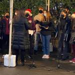 The Mercer Island High School Bel Canto Choir performs on Dec. 16 at Mercerdale Park. Following the event, the choir sang for the residents at Island House in the courtyard. Courtesy photo