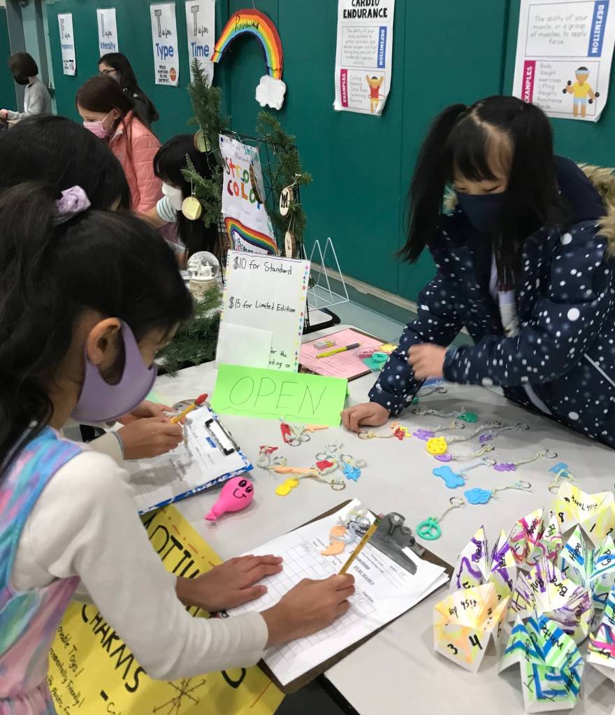 Student Audrey is open for business with her keychains at the West Mercer Market Place. Courtesy photo