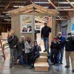 On Jan. 3, four Mercer Island Rotarians were part of a group that helped build a tiny home in coordination with Sound Foundations NW at the Hope Factory in Seattle. Sound Foundations NW, which partners with the Low Income Housing Institute to construct the abodes, states on its website: Imagine what it would be like during the pandemic not to have a home. Nowhere safe and secure to keep you from the virus. Thats why we have been deemed an essential organization and are building transitional tiny homes as fast as we can. The homes are for healthy homeless folks to stay healthy and away from the virus. Pictured Rotarians are Bunnie Cundiff (sitting on stairs); Edie Warner (in window to the right); Mike Finn (standing, second from right); and Terry Lee (farthest right). For more information, visit https://www.soundfoundationsnw.org/ . Courtesy photo