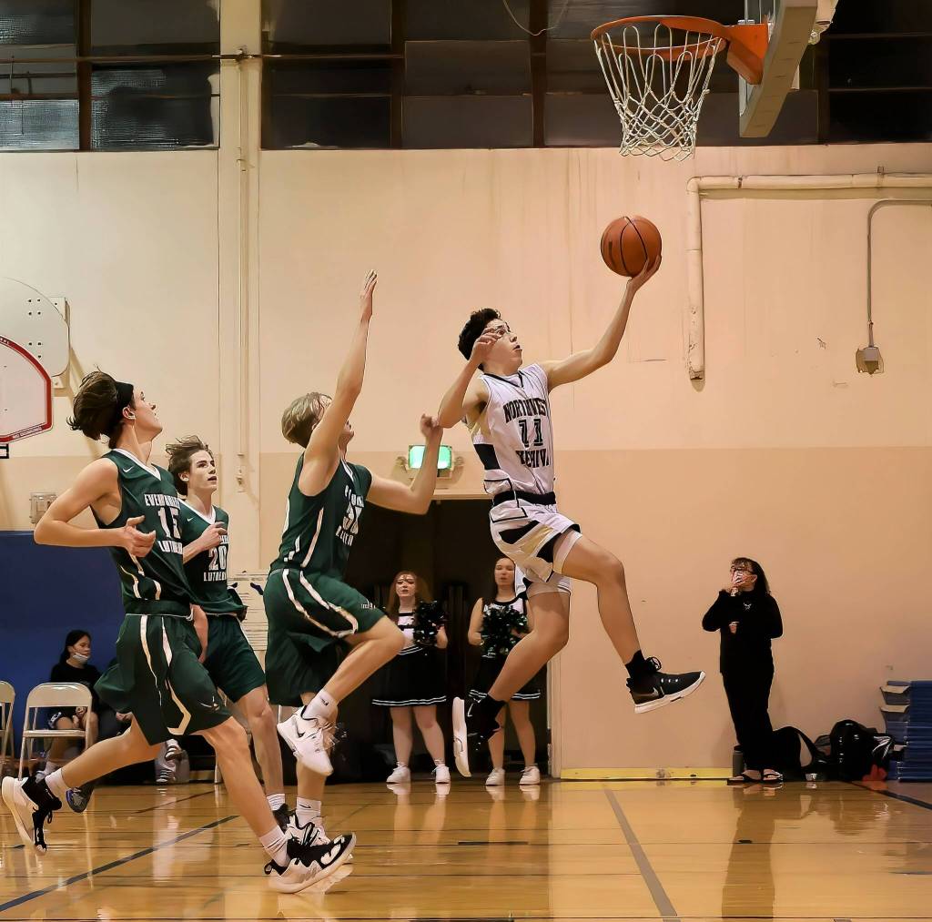 Junior Daniel Negrin drives to the hoop. Photo courtesy of David Jacoby