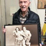 Peter Kennedy displays a photo of him and his sister Karol, who were the pairs figure skating silver medalists at the 1952 Winter Games in Oslo. Courtesy photo
