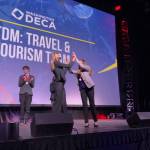 Mercer Island High School seniors Hannah Hobson, left, and Kayla Friedman react after receiving first place in their event, Travel and Tourism Team Decision Making, at the Washington DECA State Career Development Conference, which took place March 3-5 at the Meydenbauer Center & Theatre in Bellevue. Courtesy photo