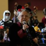 Longtime Mercer Island orchestra director Vicki White-Miltun addresses the crowd at the Disney and Dessert Fundraising Event on March 6 in the Mercer Island High School commons. Photo courtesy of Bao-Tran Nguyen
