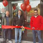 From left, Mercer Island Deputy Mayor David Rosenbaum, Mayor Salim Nice and FaveKitchens founder/CEO Praveen Akula gather at the restaurants grand opening on March 11. Andy Nystrom/ staff photo